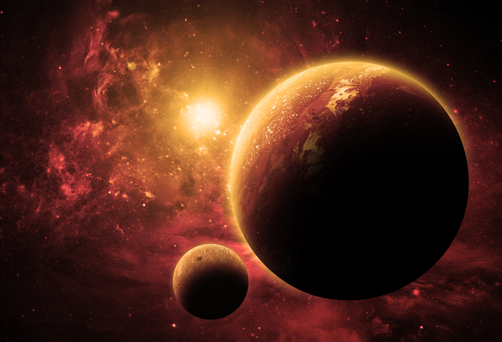 A red planet and its moon in a glowing nebula